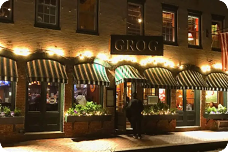 The Grog exterior illuminated at night