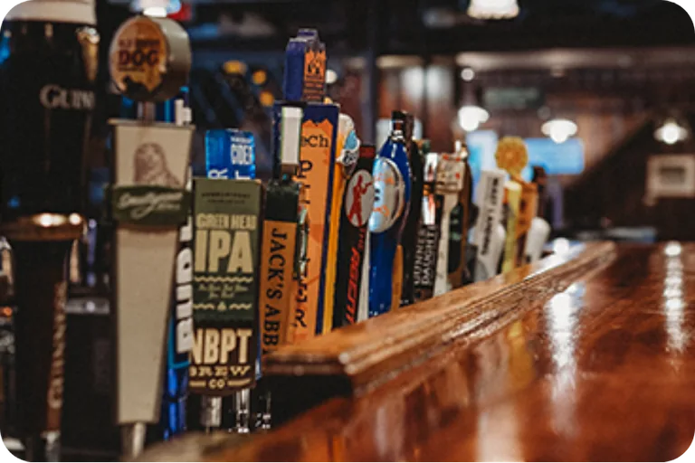 Craft beer taps along the bar